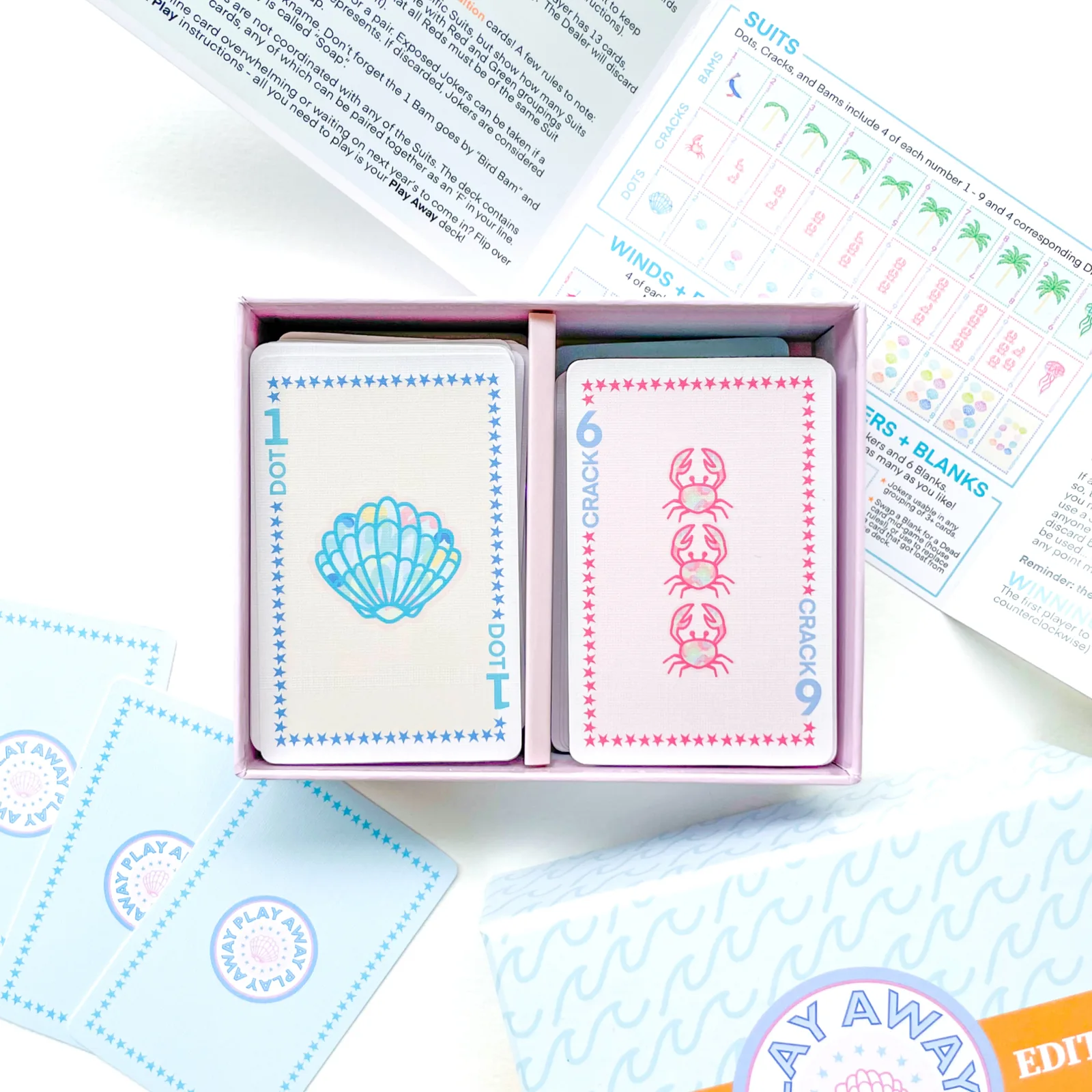 Beach Edition open tray: a shell 1 Dot and a crab 6 Crack card on top, guide unfolded behind