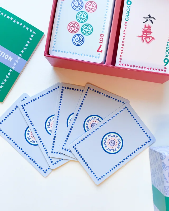 A fan of Classic Edition card backs on a white table