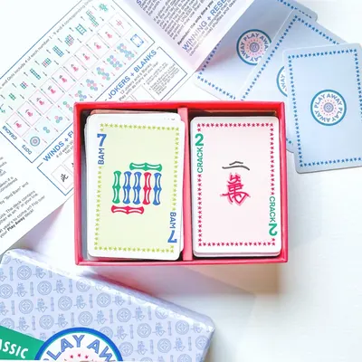 Classic Edition open tray showing a 7 Bam and a 2 Crack card with the guide unfolded behind