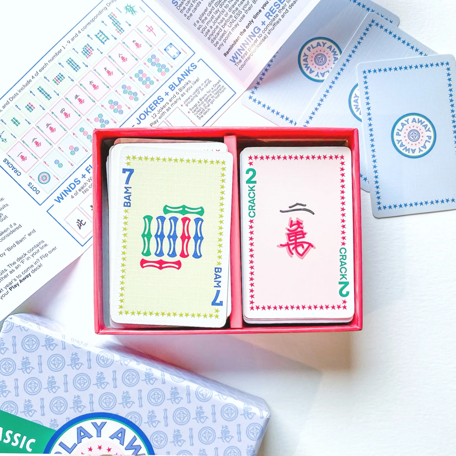 Classic Edition open tray: a 7 Bam and a 2 Crack card on top, guide unfolded behind