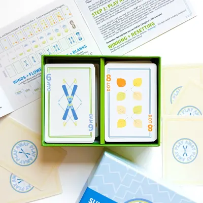 Summit Edition open tray showing a crossed skis 6 Bam and an aspen leaf 8 Dot card